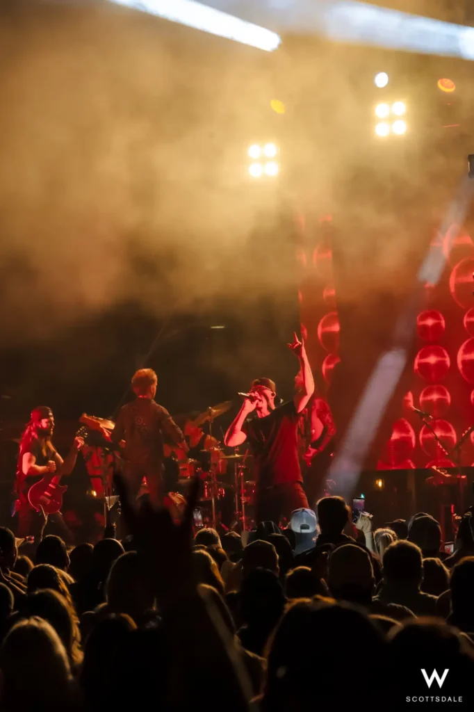 Rock the rooftop 2025 band performance red led wall crowd