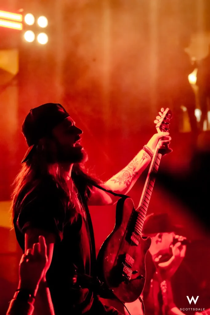 Rock the rooftop 2025 guitarist red stage lights close up